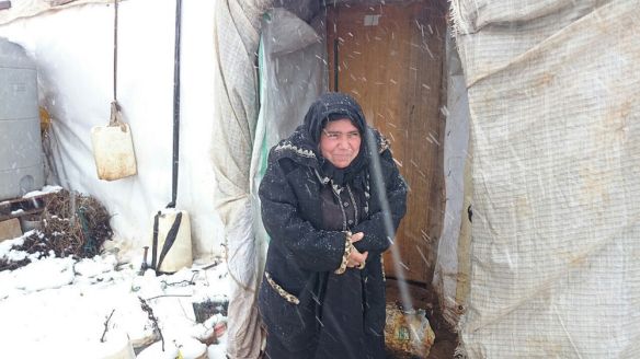 woman refugee caught in snow