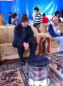 refugee men and boys shelteed in a community center