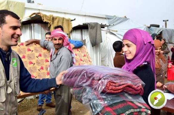 Distributing blankets to refugees
